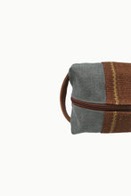 Load image into Gallery viewer, Close up of Light Gray Chaguar Travel Bag with Brown Stitching Designs. Dark Brown Zipper with Dark Brown Leather Handle on side.
