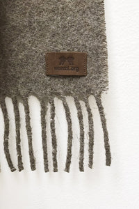 Close up of Gray Mink Llama and Sheep Wool Scarf. Close up of Fringe ends with tag. 